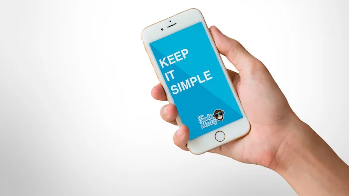 Phone in hand with text on the screen, Keep it simple